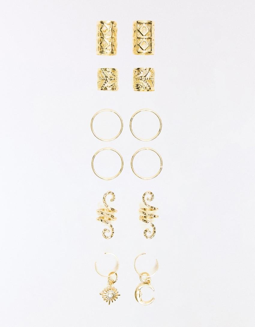 A collection of gold hair rings arranged in three rows: the top row features two pairs of decorative studs, the middle row showcases two pairs of hoops, and the bottom row includes two pairs of spiral rings and a charm