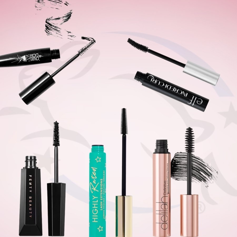 A selection of different cruelty-free mascara tubes in various colours and shapes arranged on a pink background