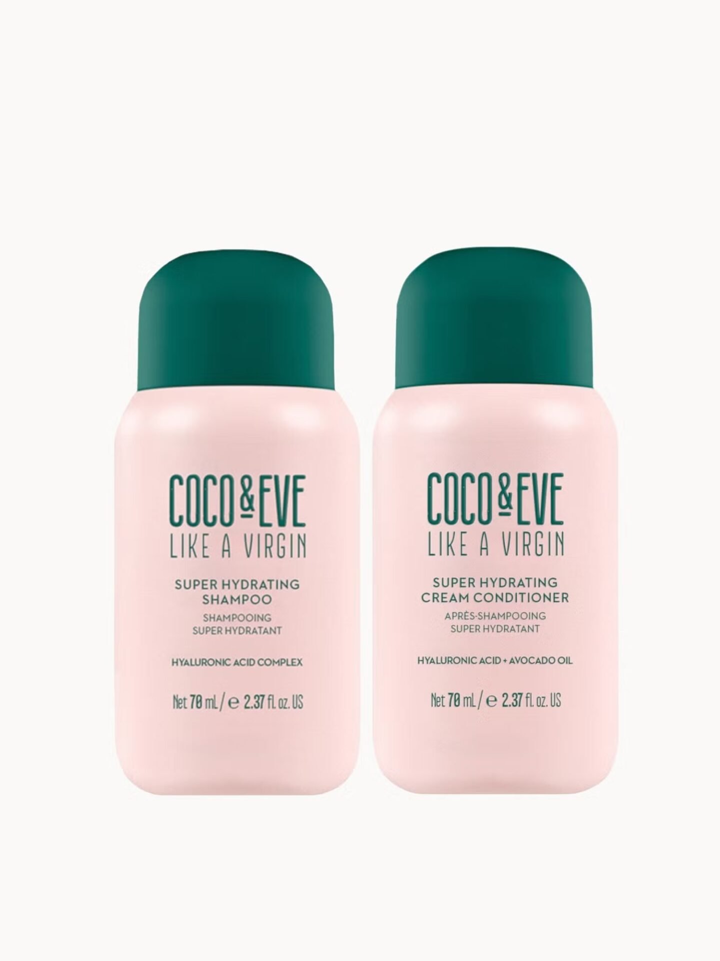 Two small pink bottles of Coco & Eve Super Hydrating Shampoo and Cream Conditioner with green caps
