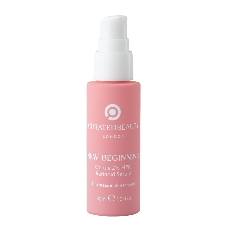 Pink bottle of Curated Beauty's New Beginning retinoid serum with a white pump top