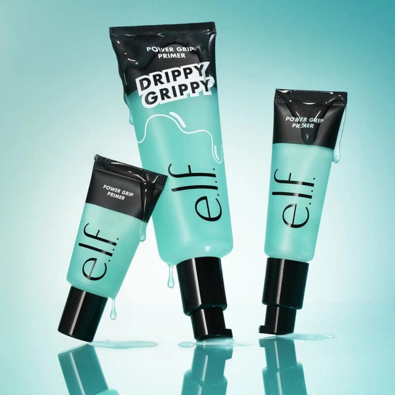 Three containers of e.l.f. Power Grip Primer in varying sizes with a turquoise background