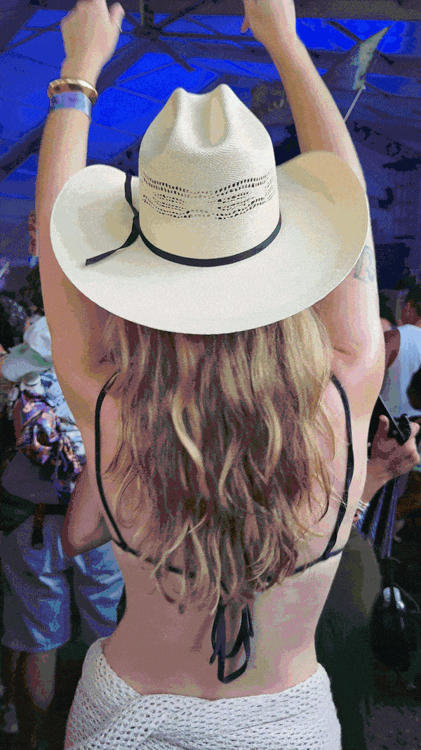 woman with beach waves dancing at a festival