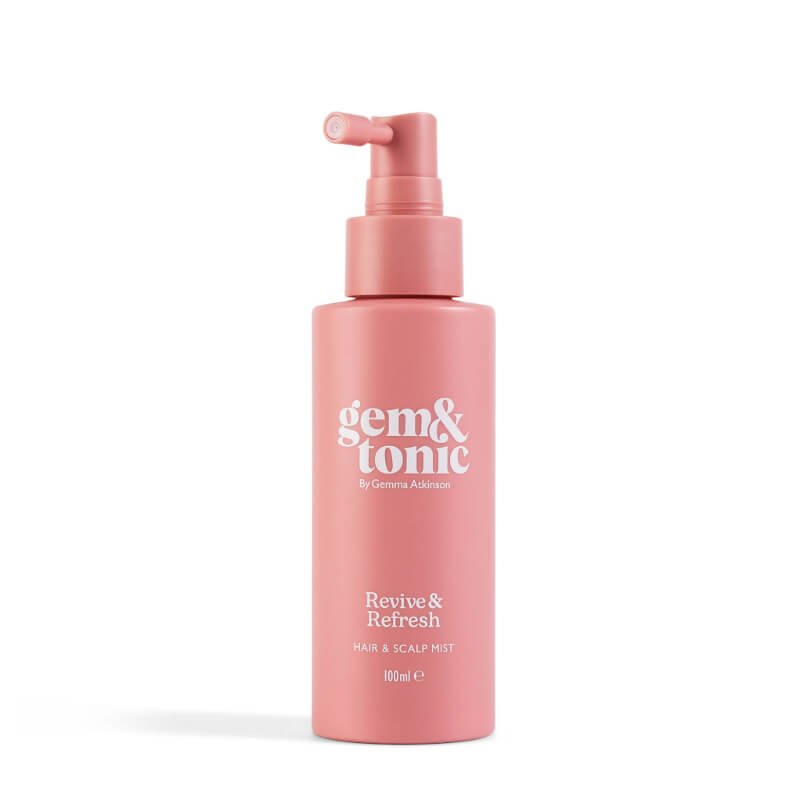 A pink bottle of Gem & Tonic Revive & Refresh hair and scalp mist with a pump dispenser