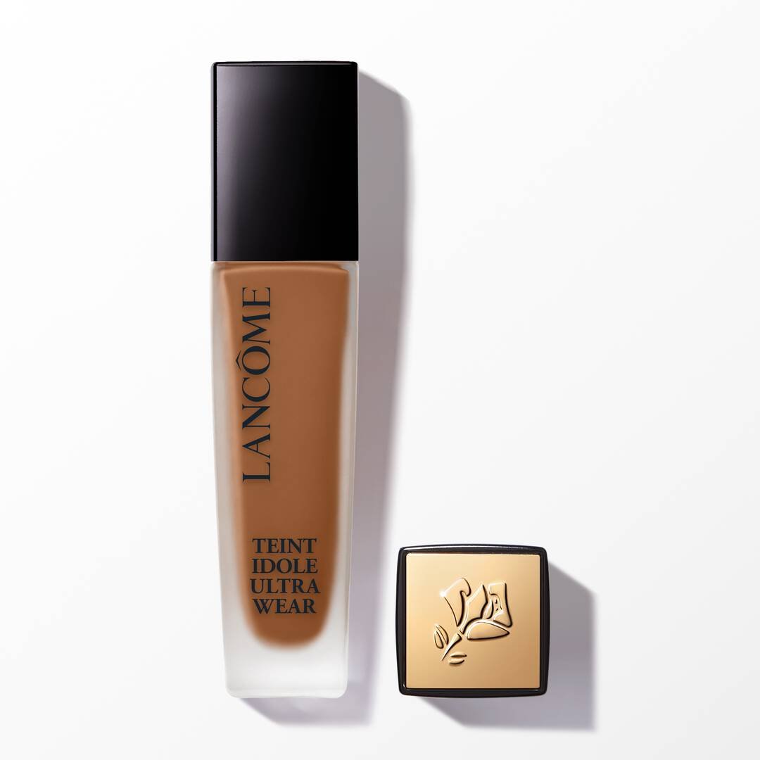 Lancôme Teint Idole Ultra Wear foundation bottle with a gold lid featuring the Lancôme rose logo