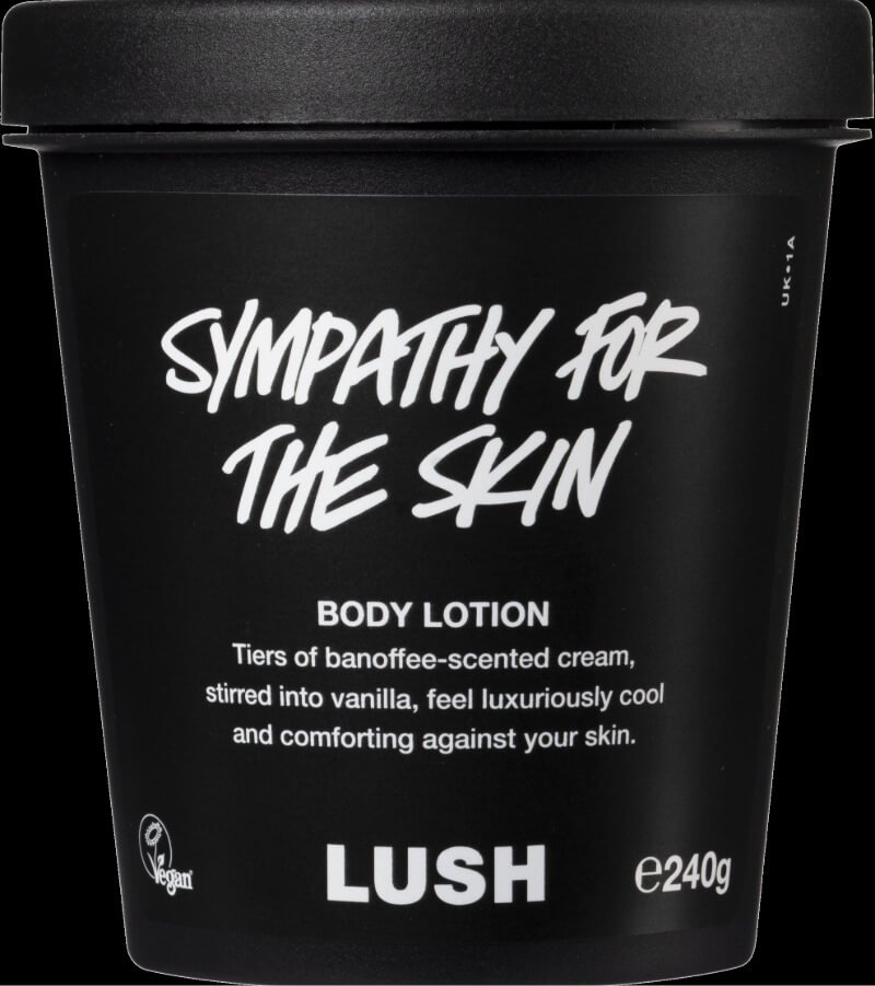 Black container of Lush's 'Sympathy for the Skin' body lotion with white text and vegan icon