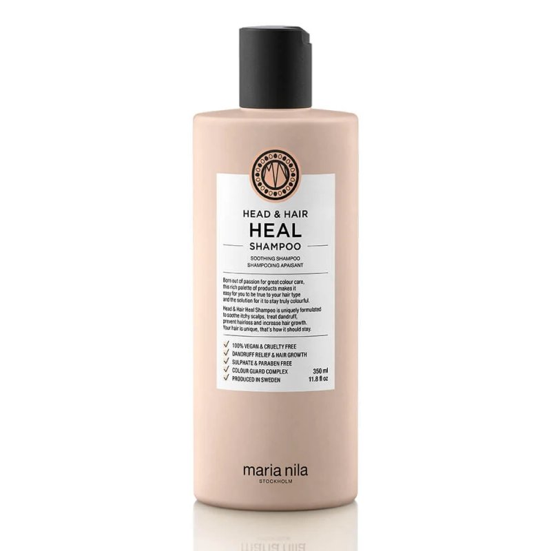 A bottle of Maria Nila Head & Hair Heal Shampoo, featuring a pink label and a black pump top