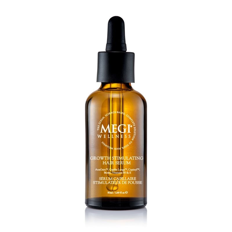 Megi Wellness growth stimulating hair serum in a brown glass bottle with a dropper