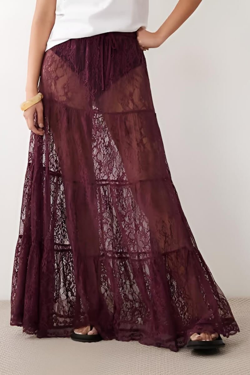 Model wearing Miss Selfridge burgundy lace maxi skirt with a tied waist, styled with a simple top and accessories