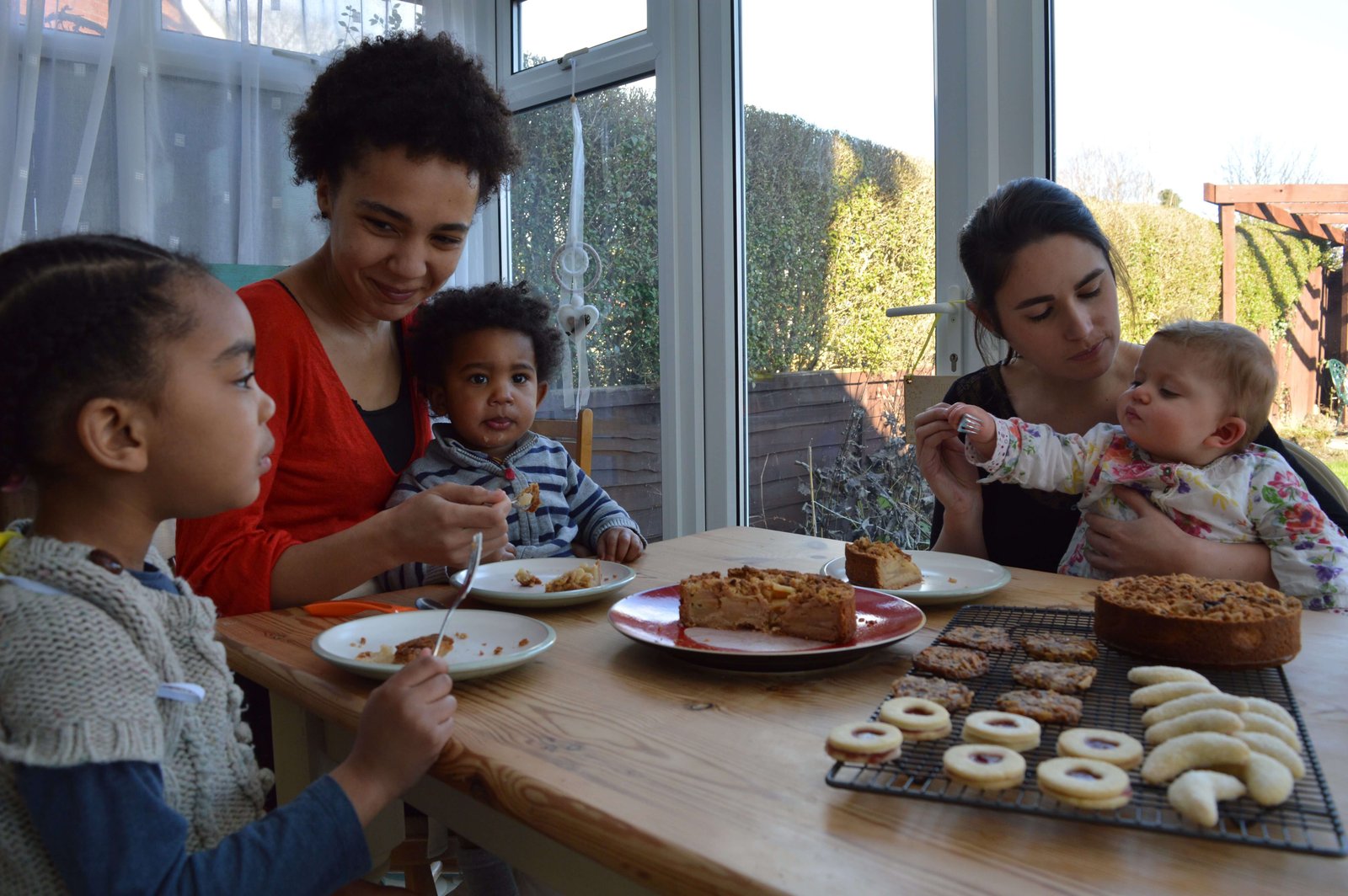 Lisa Shepherd and Saskia Roskam with their children at home while baking and building The Biskery, reflecting the realities of motherhood and entrepreneurship