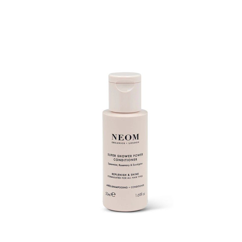 A 50ml bottle of Neom Super Shower Power Conditioner with a light pink design and black text