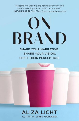 Book cover of On Brand by Aliza Licht, set against a light blue background. The title appears in large black letters above three takeaway coffee cups, with a bright pink cup in the centre standing out from two white cups behind it. A tagline about shaping your narrative and shifting perception appears beneath the title.
