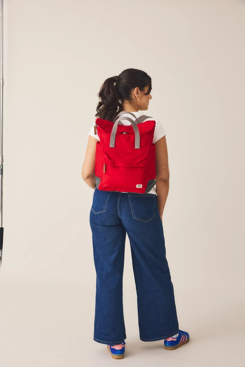 ROKA London Bayswater umbrella backpack in cranberry, back view with roll-top design and spacious front pocket