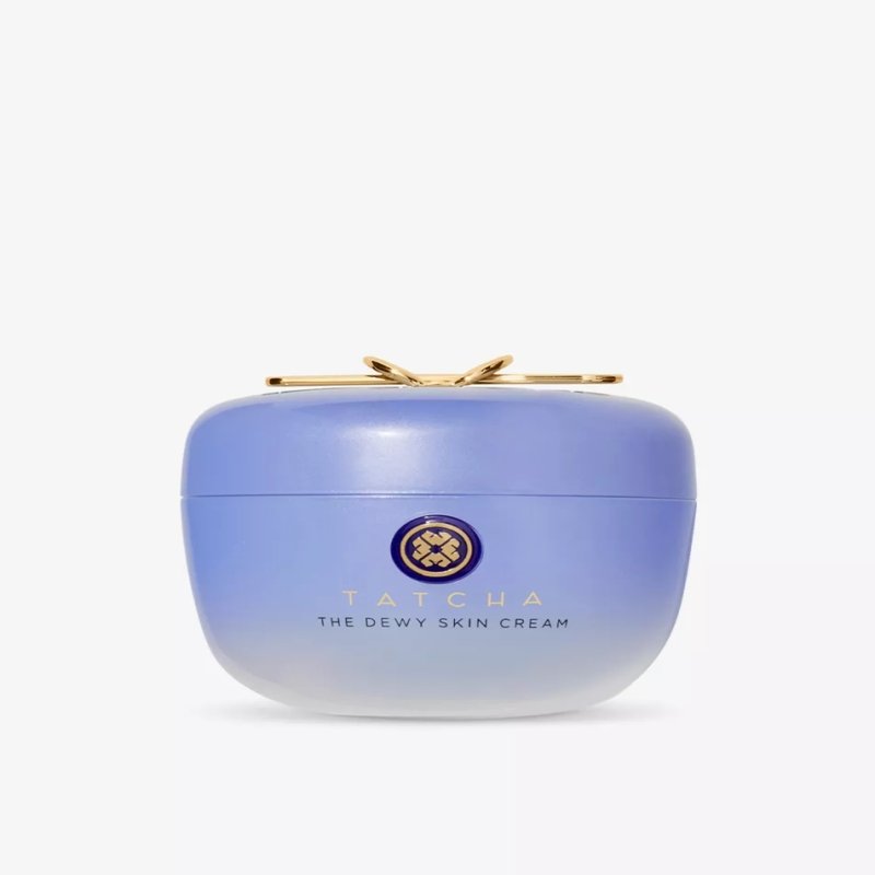 Light purple cream jar with a golden clasp, containing Tatcha's Dewy Skin Cream