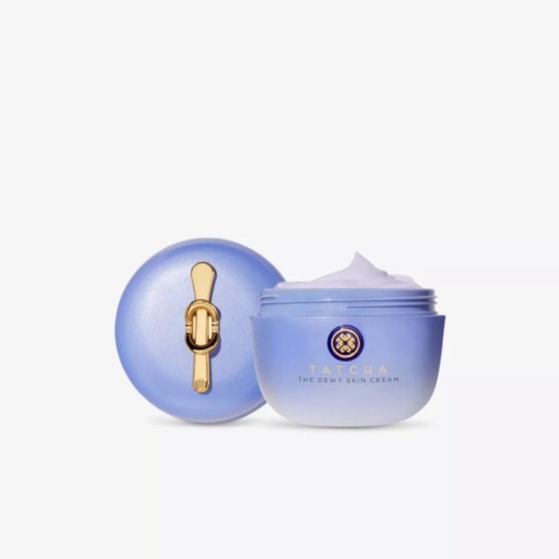 Light purple cream jar with a golden clasp, containing Tatcha's Dewy Skin Cream