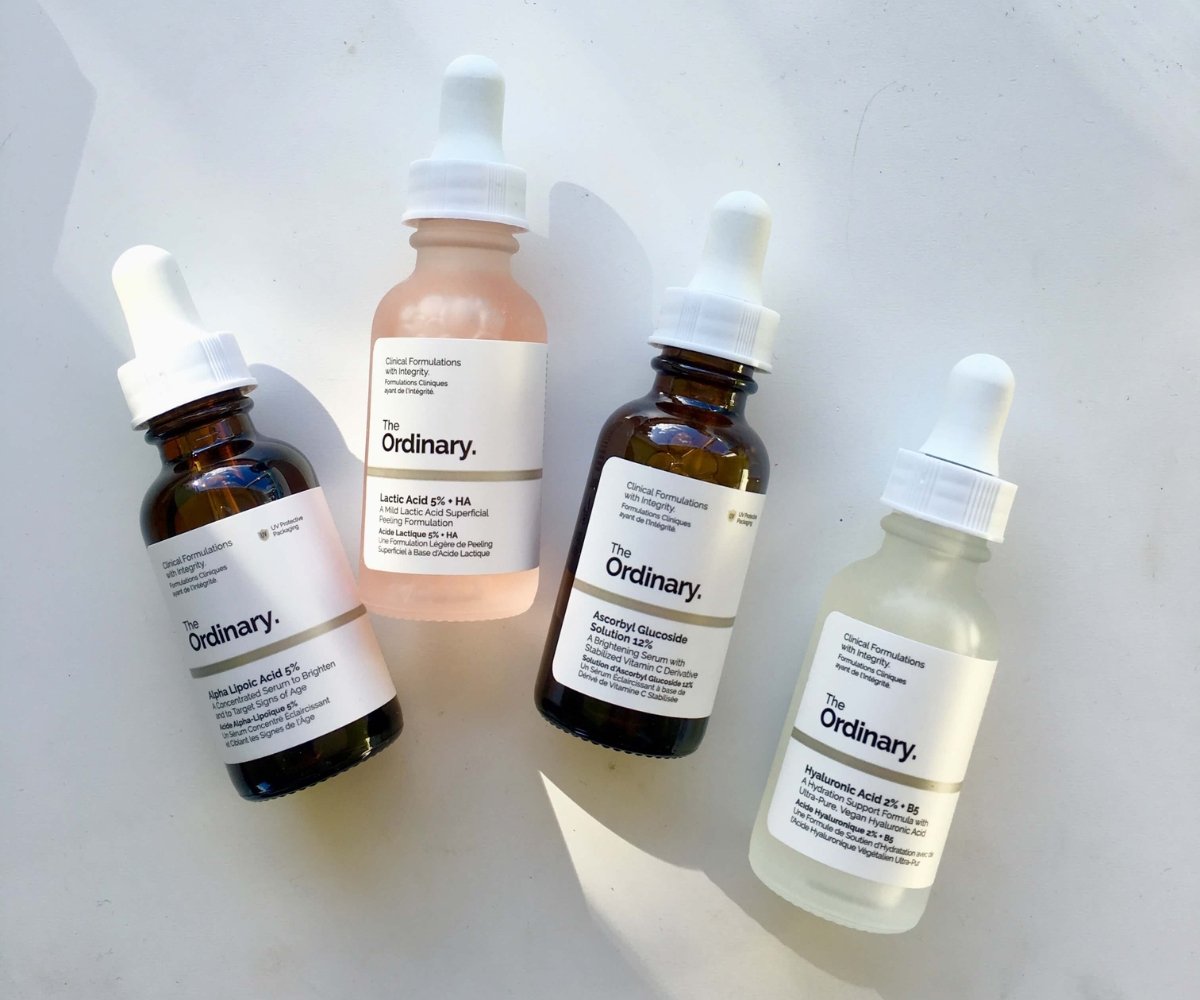 A clean, minimalist flat lay showcasing four The Ordinary skincare serums, including hyaluronic acid, lactic acid, vitamin C and antioxidant formulas. Displayed on a white background, the image highlights popular products by cruelty-free skincare brand - best cruelty-free beauty brands