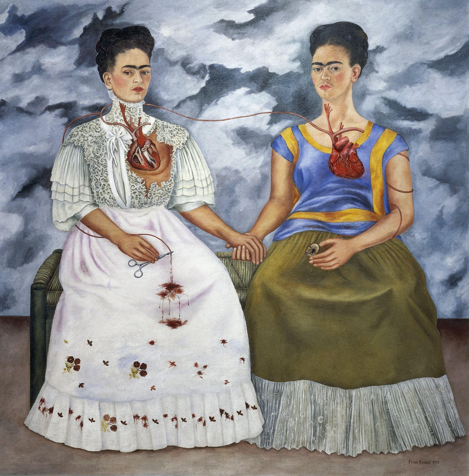 A surrealist double self-portrait by Frida Kahlo showing two versions of herself seated on a bench, holding hands and connected by a shared vein between their exposed hearts.