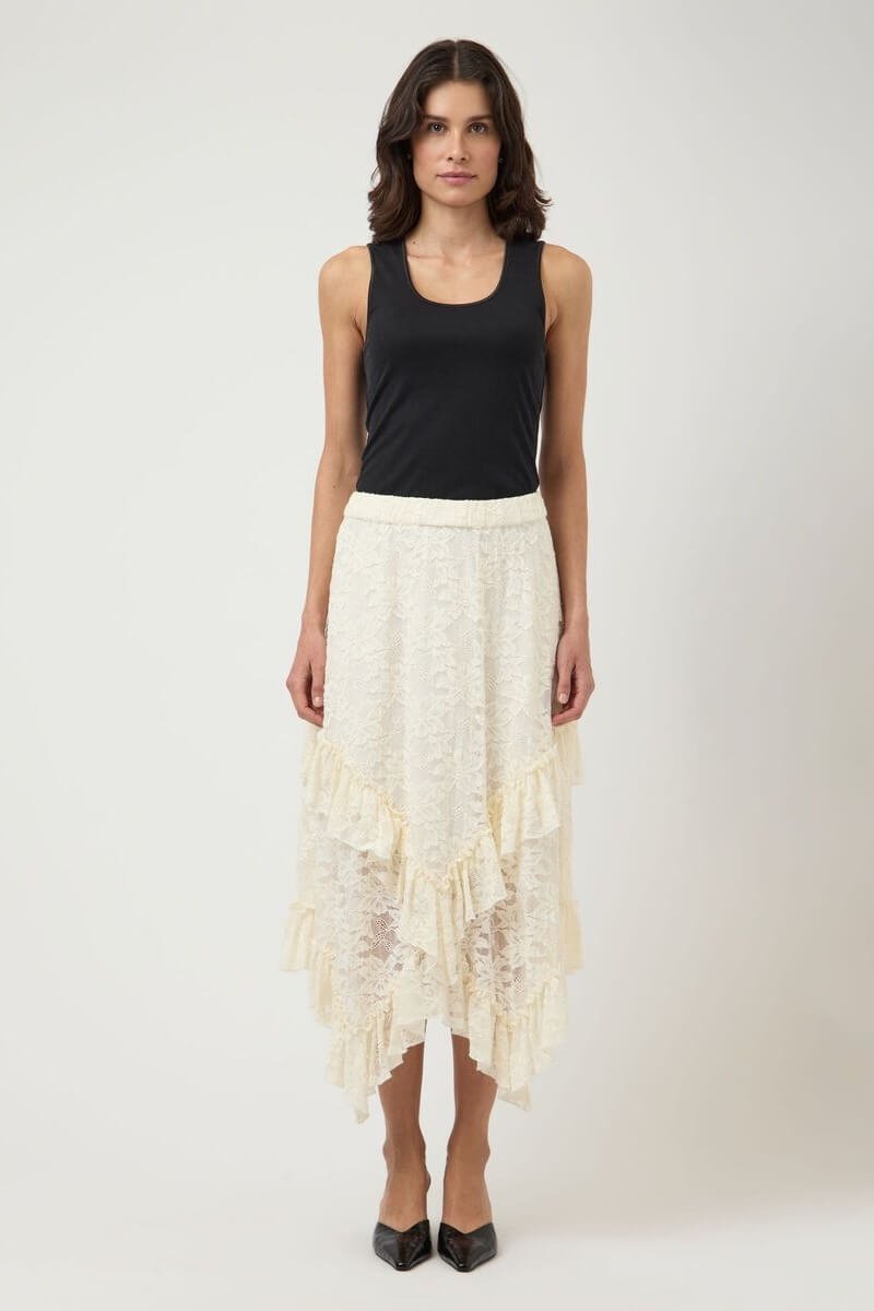 YAS cream lace ruffle hem skirt paired with a black tank top